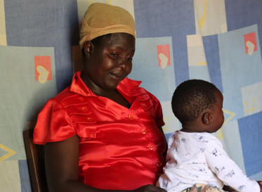 Eglyne Indeku with his son Ezekiel Mwenje during a home visit